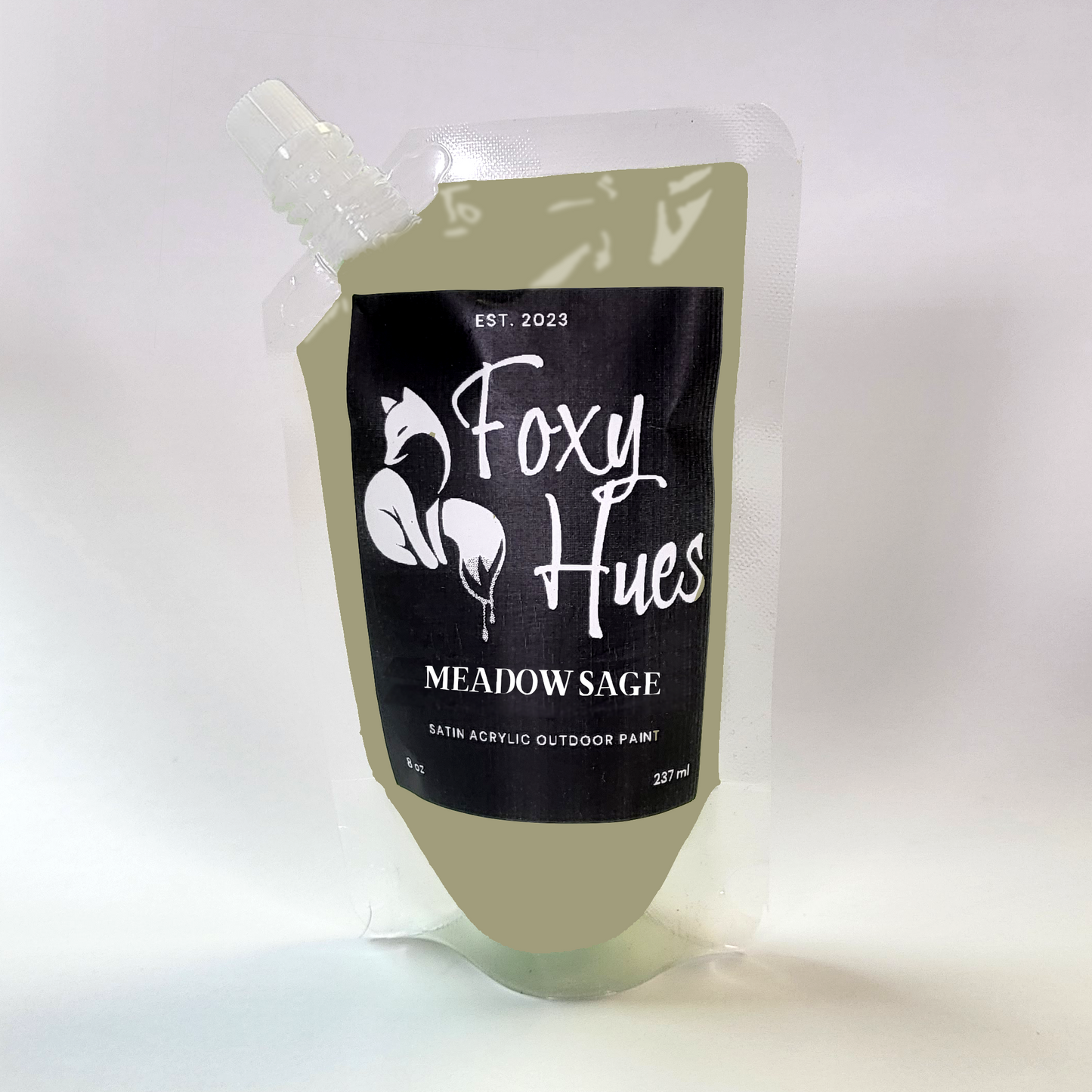 Paint container labeled 'Foxy Hues Meadow Sage' on a white background