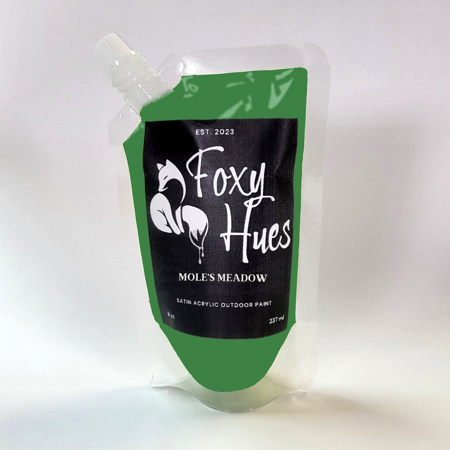 Green and black paint pouch with 'Foxy Hues' branding on a white background
