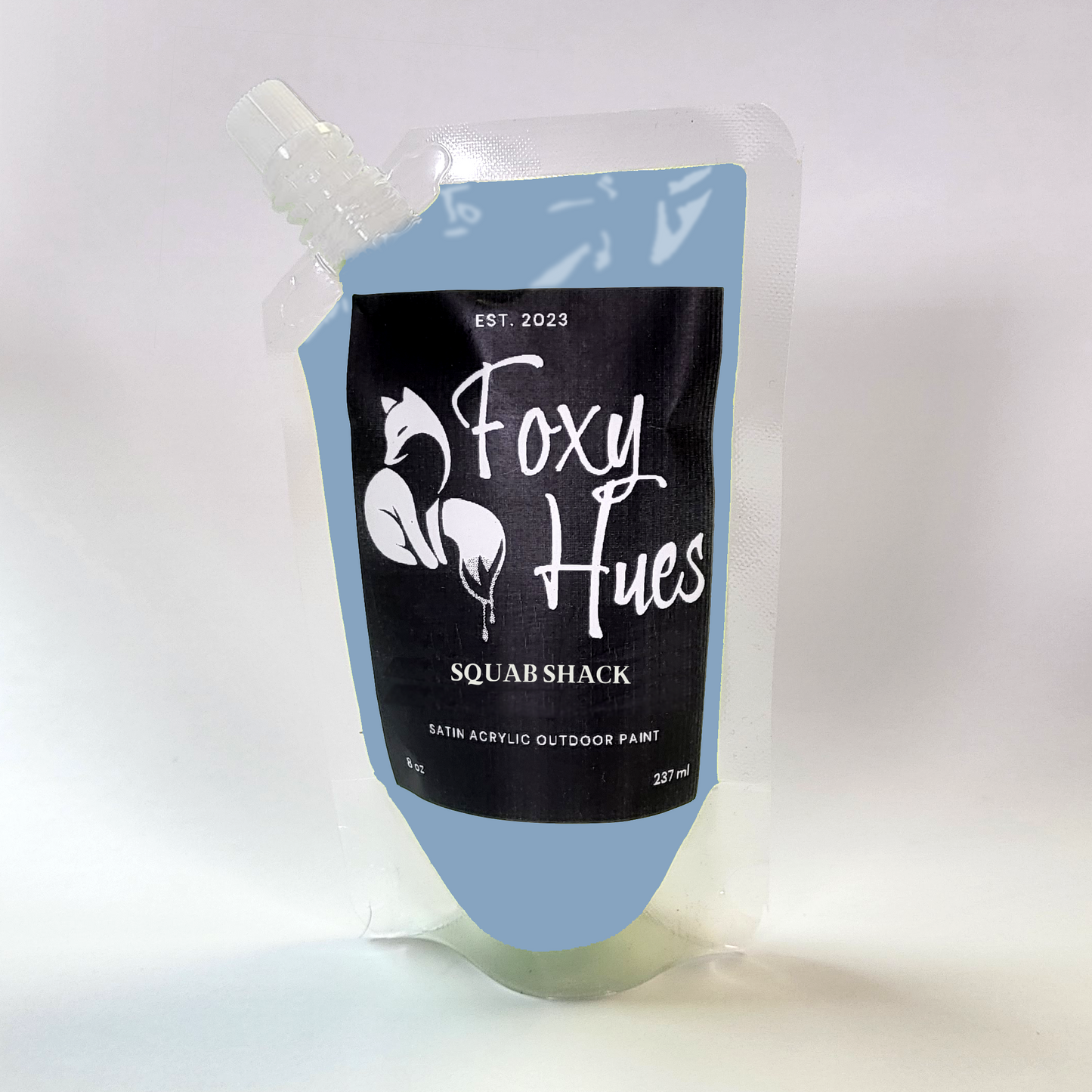 container of 'Foxy Hues Squab Shack' paint with a black label on a white background