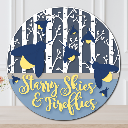 Decorative wall art with fireflies and 'Starry Skies & Fireflies' text on a blue background.