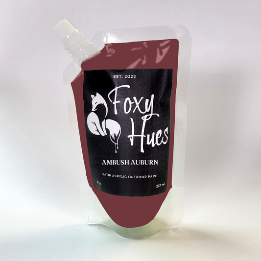 Foxy Hues paint pouch with 'Ambush Auburn' color on a white background