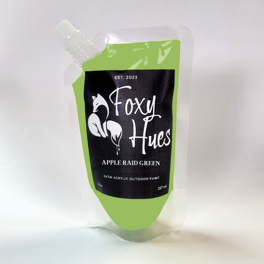 Green paint pouch with 'Foxy Hues' branding on a white background