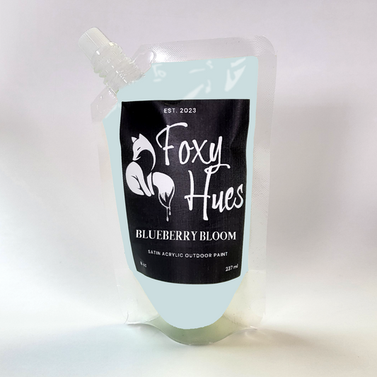 paint container with 'Foxy Hues' branding on a white background