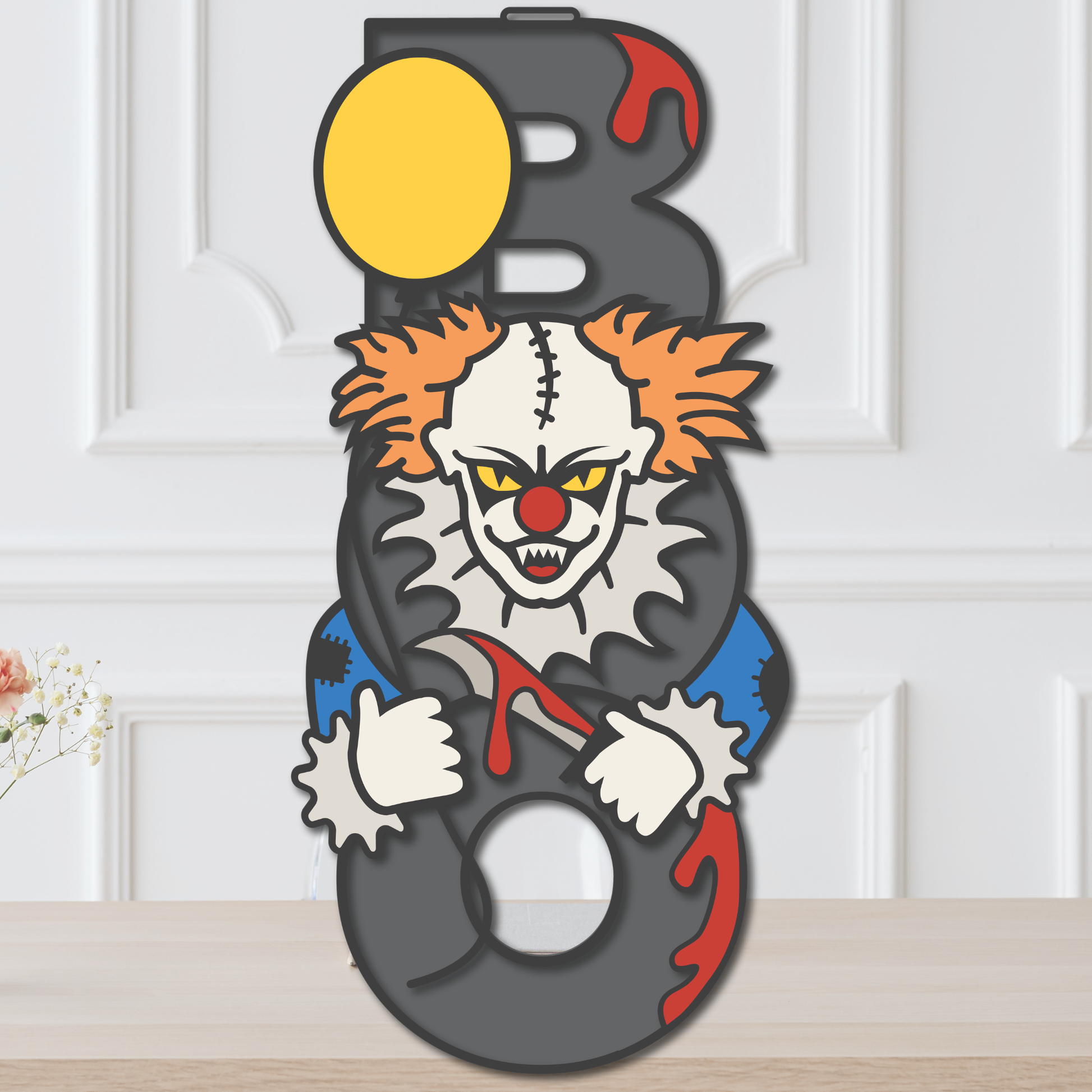 Layered Creepy Clown BOO Halloween door hanger with sinister clown, black lettering, orange hair, and dripping red details