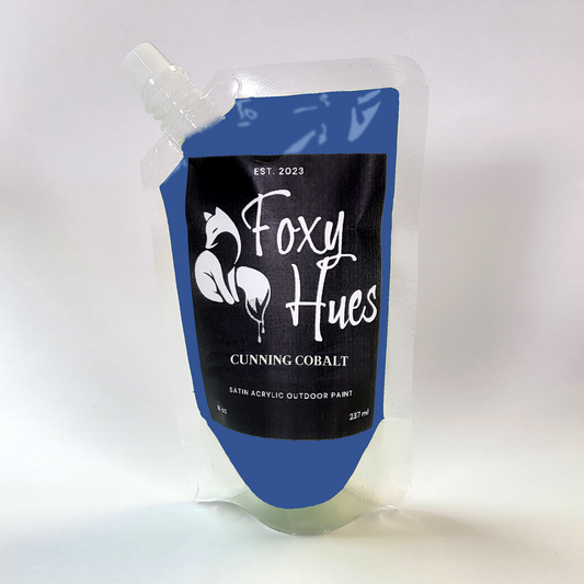 Foxy Hues paint pouch with blue and black design on a white background