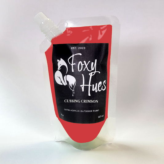 Foxy Hues paint pouch with red and black design on a white background