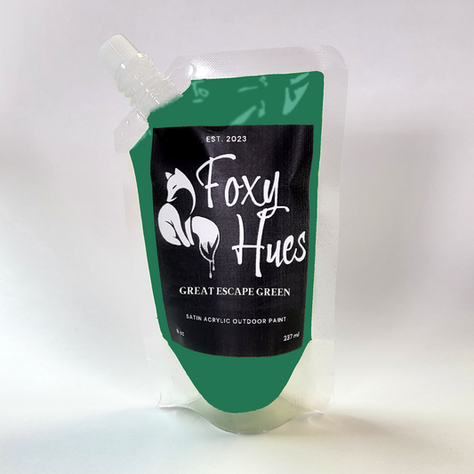 Green paint pouch with 'Foxy Hues' branding on a white background