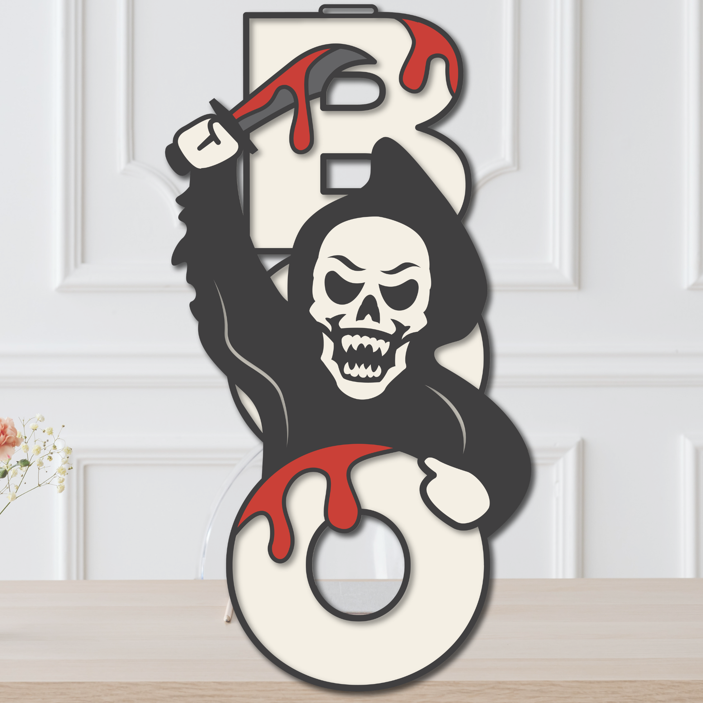 Layered Grim Reaper BOO Halloween door hanger with hooded skeleton, bloody scythe, cream lettering, and dripping red details