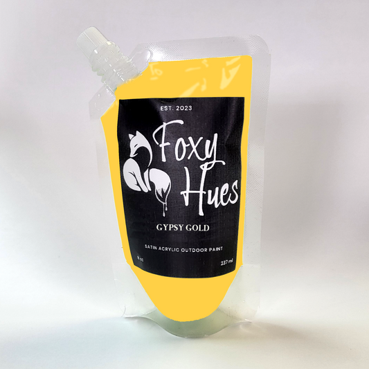 Foxy Hues acrylic outdoor paint pouch with yellow and black design on a white background