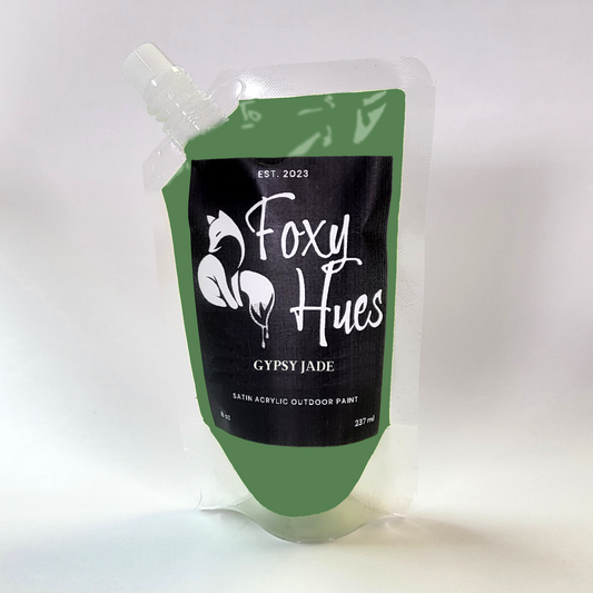 Green paint pouch with 'Foxy Hues' branding on a white background