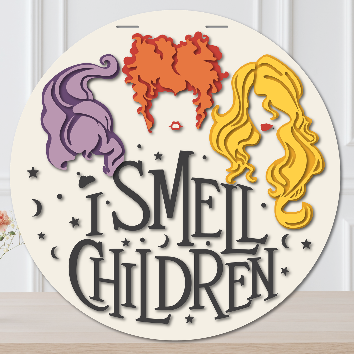 Layered I Smell Children Halloween door hanger with three colorful witch hairstyles, stars, moons, and black lettering