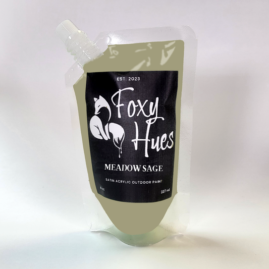 Paint container labeled 'Foxy Hues Meadow Sage' on a white background