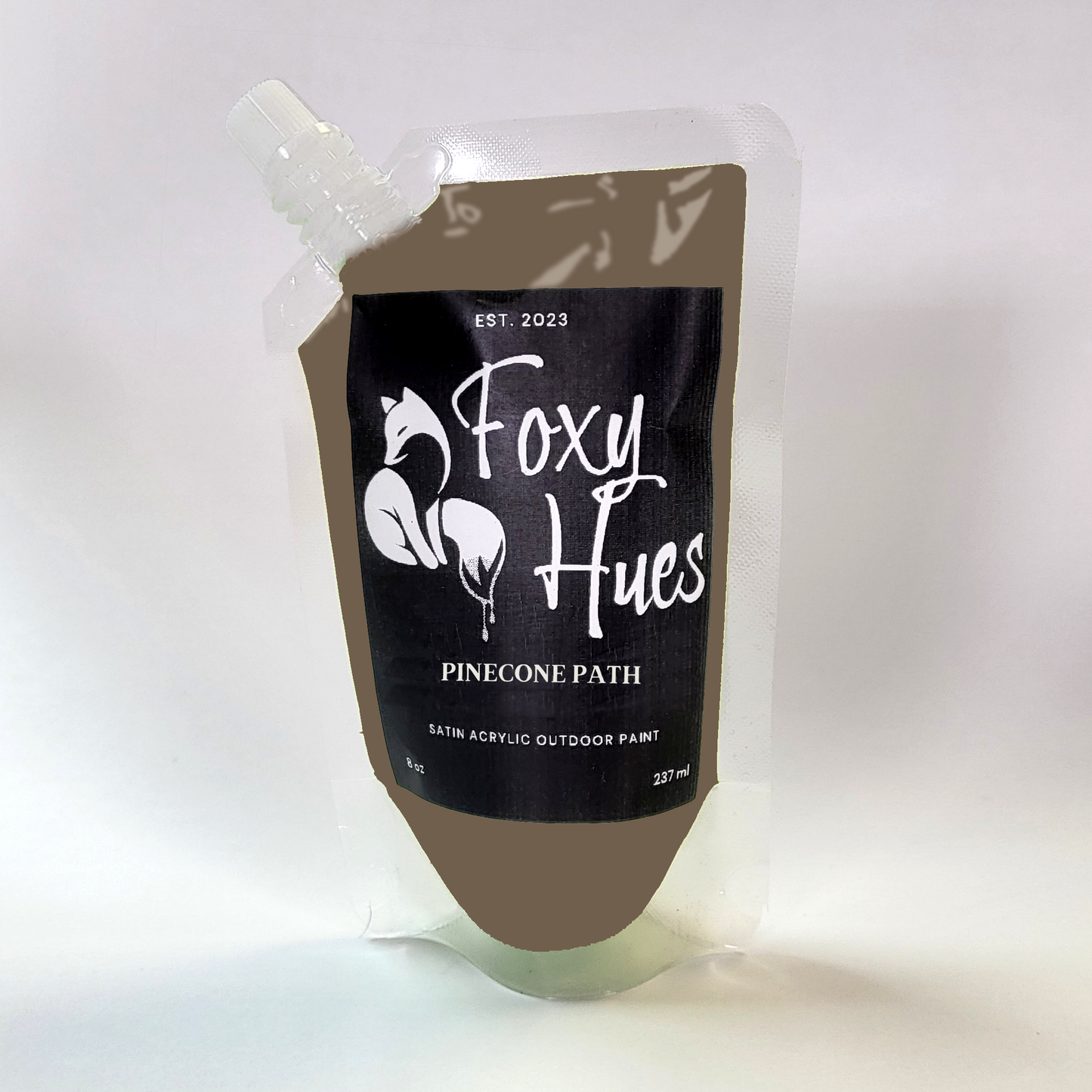 Paint container with 'Foxy Hues' branding on a white background