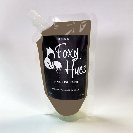 Paint container with 'Foxy Hues' branding on a white background