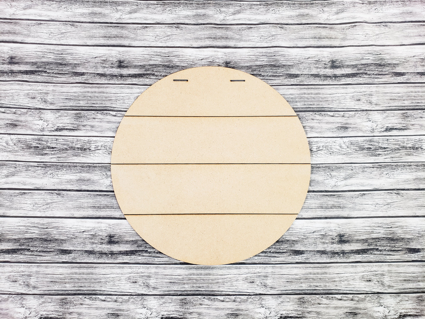 Round wooden board on a rustic wooden surface