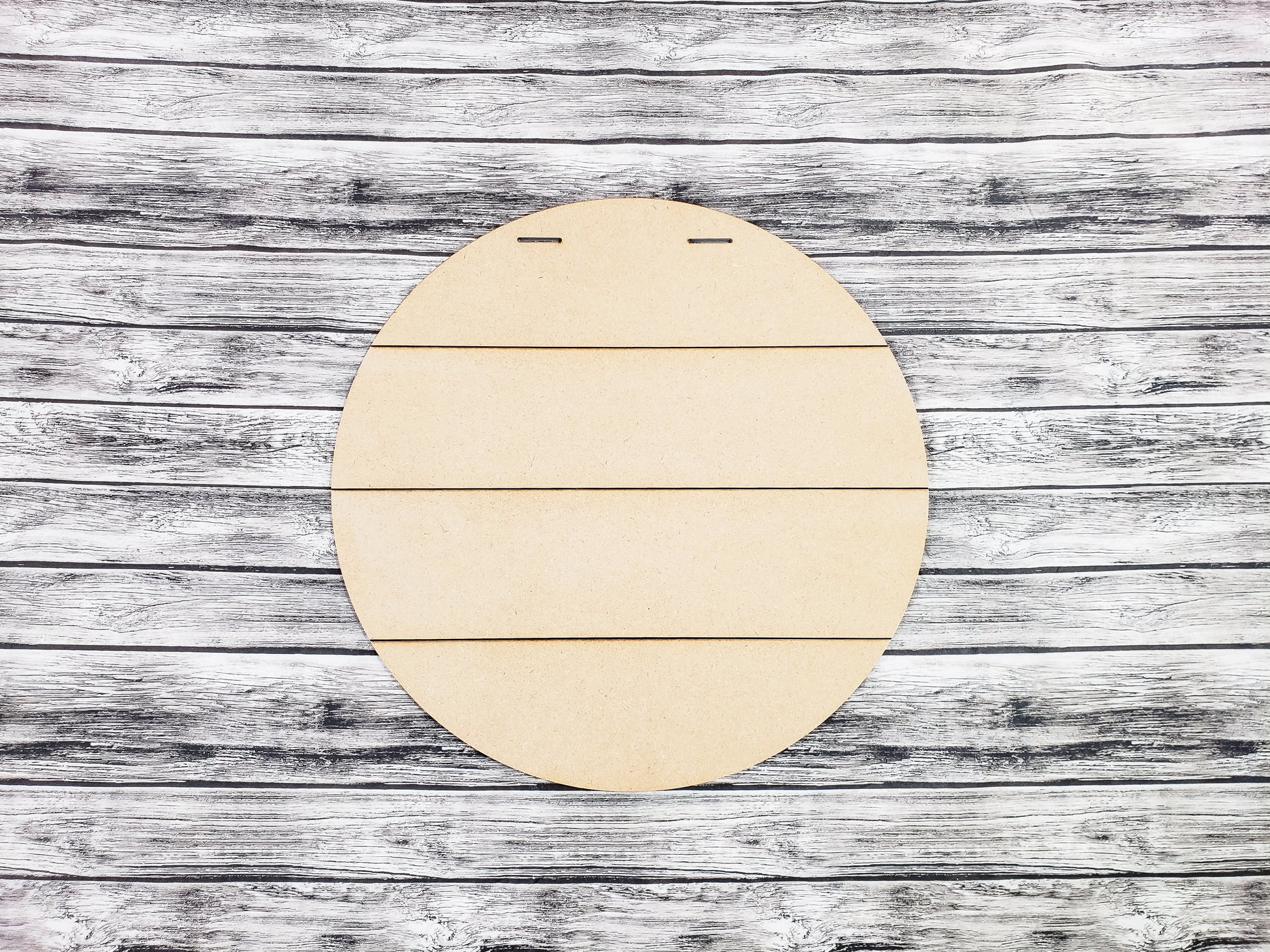 Round wooden board on a rustic wooden surface