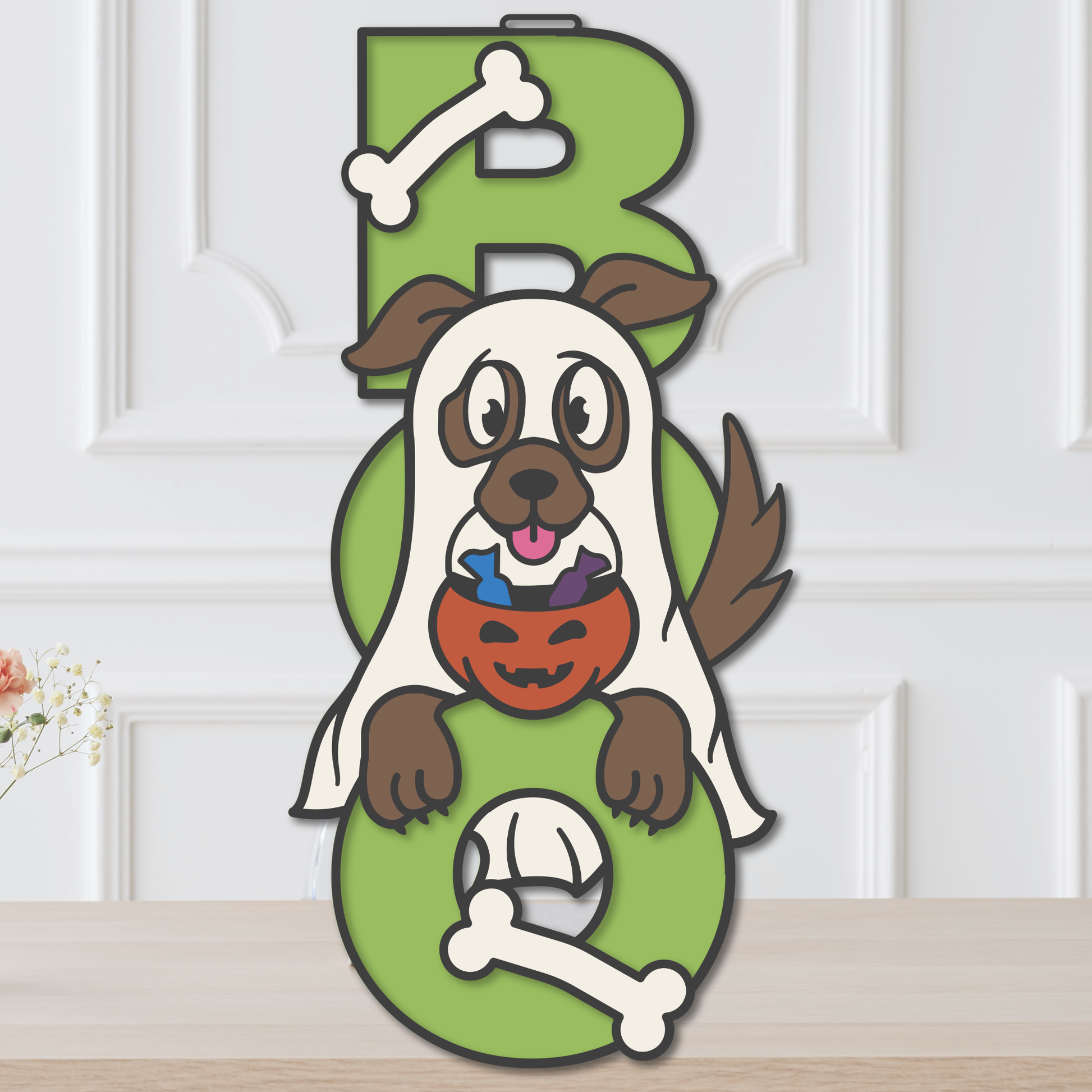Layered Ghost Dog BOO Halloween door hanger with puppy in a ghost costume, pumpkin candy bucket, bones, and green lettering