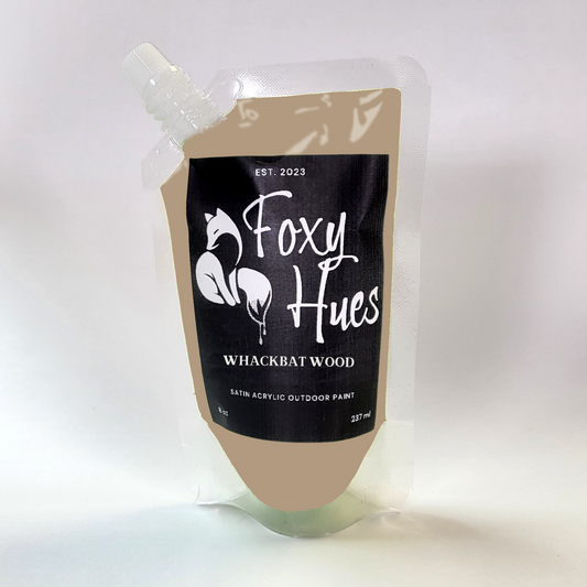 Paint container with 'Foxy Hues' label on a white background