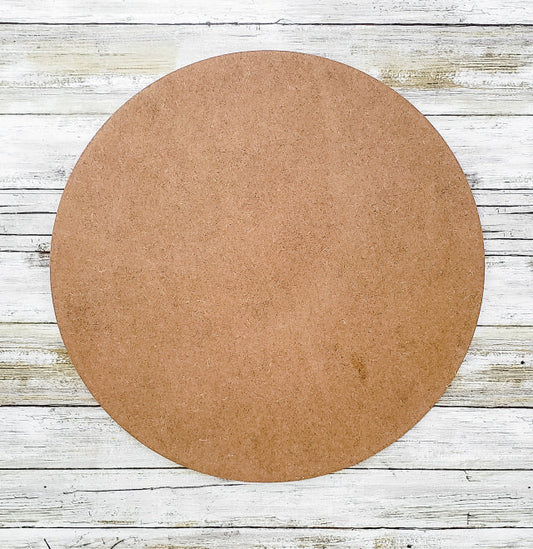 Round MDF piece on a wooden surface